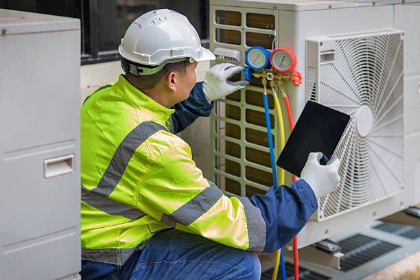 Professional Heat Pump Repair technician working in Charlestown, IN